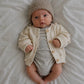 vetement-bebe-gilet-en-maille-à-pois-texturès-beige-pour-bébé