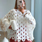 pull-de-grossesse-en-maille-ajourée-blanc-avec-trous-manches-bouffantes