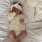 vetement-bebe-gilet-en-maille-à-pois-texturès-beige-pour-bébé