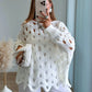 pull-de-grossesse-en-maille-ajourée-blanc-avec-trous-manches-bouffantes
